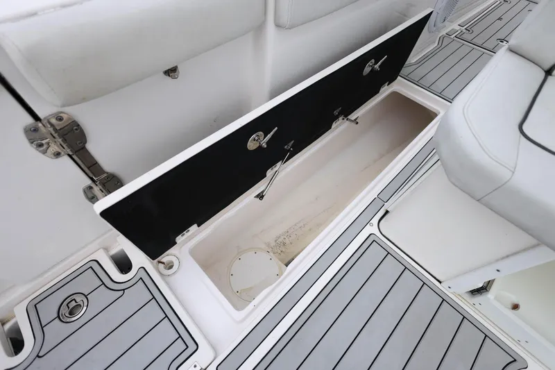 Slide: The Image of 2022 Sea Fox 368 Commander storage compartment with open hatch, showcasing sleek design. - 42