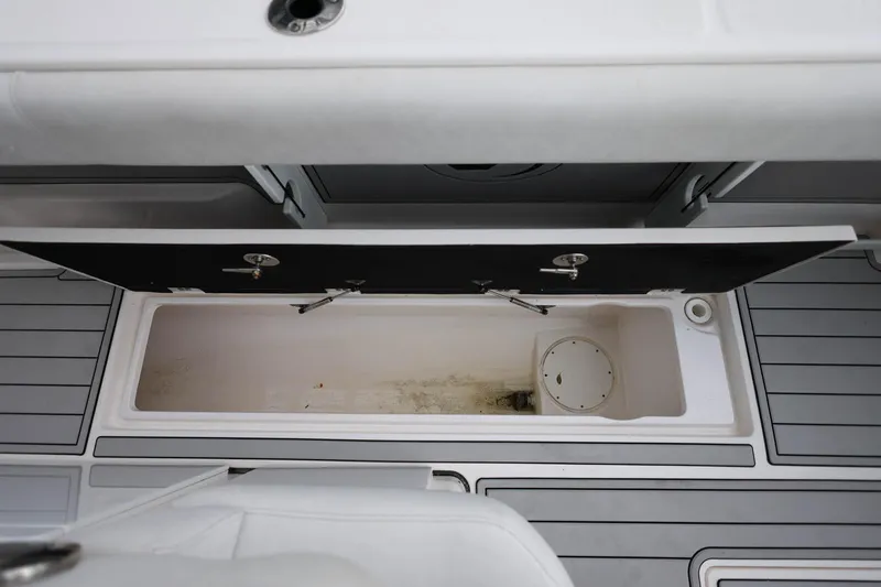 Slide: The Image of 2022 Sea Fox 368 Commander storage compartment with open lid, showcasing interior space. - 44