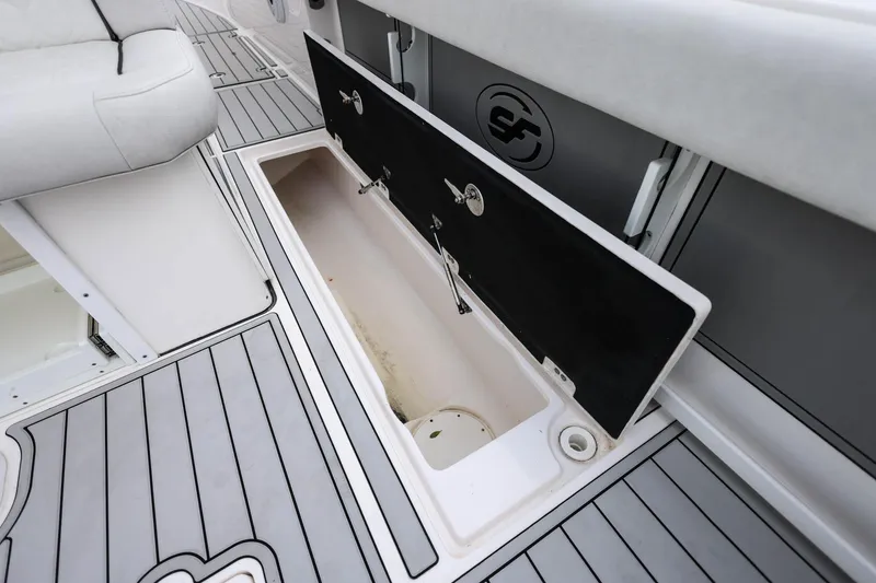 Slide: The Image of 2022 Sea Fox 368 Commander boat storage compartment with open hatch and sleek interior design. - 46