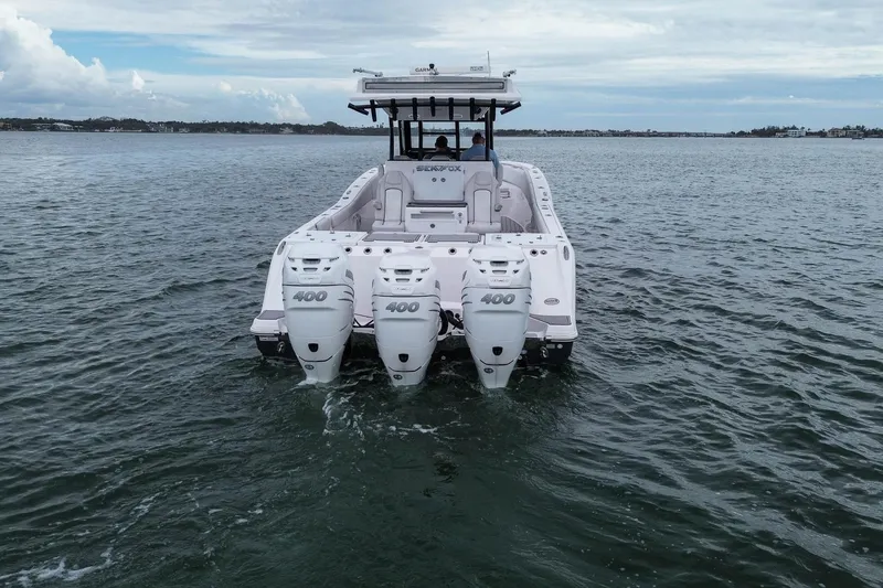 Slide: The Image of 2022 Sea Fox 368 Commander boat with triple 400 horsepower engines on open water. - 6
