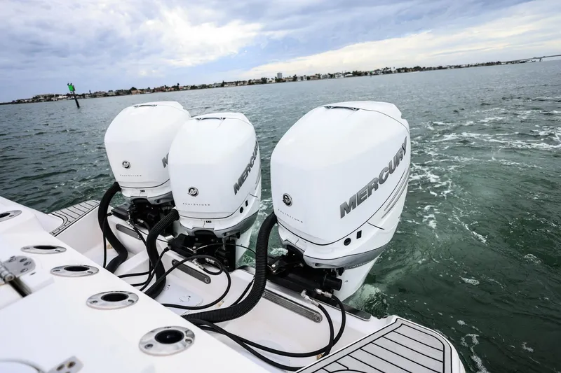 Slide: The Image of 2022 Sea Fox 368 Commander with triple Mercury outboard engines on open water. - 7
