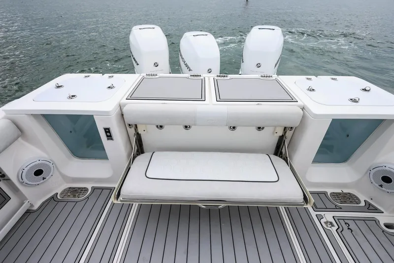 Slide: The Image of 2022 Sea Fox 368 Commander boat with foldable seating and triple outboard engines. - 8