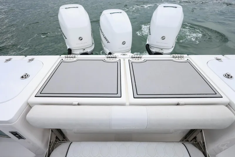 Slide: The Image of 2022 Sea Fox 368 Commander with triple outboard engines on calm water. - 9