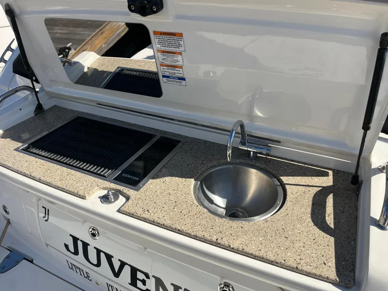 Slide: The Image of Outdoor kitchenette on 2018 Sea Ray Sundancer 350 yacht with sink and grill. - 19