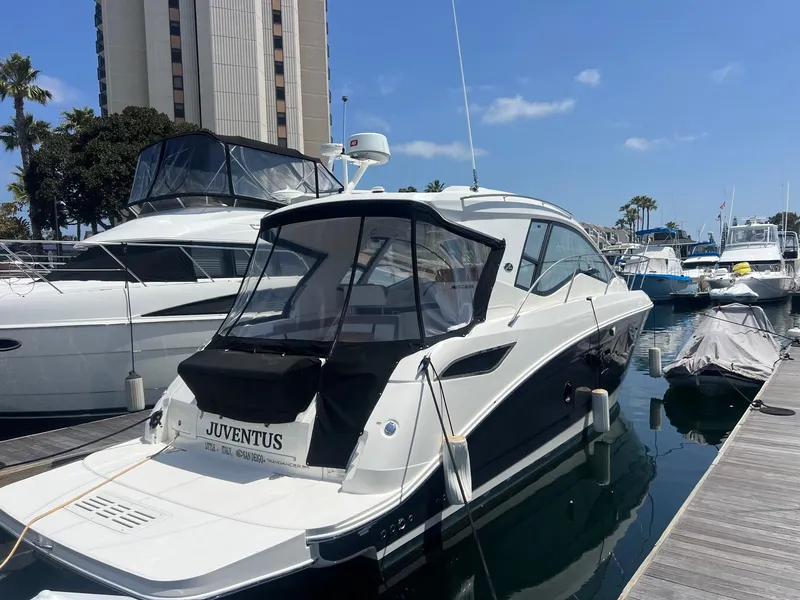 Slide: The Image of 2018 Sea Ray Sundancer 350 docked at marina under clear blue sky. - 5