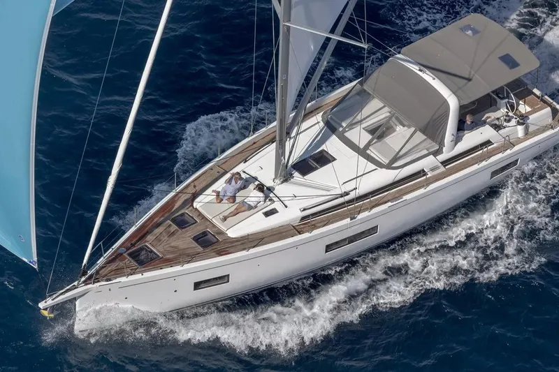 The Image of 2026 Beneteau Oceanis Yacht 54 sailing on open sea, aerial view. - 0