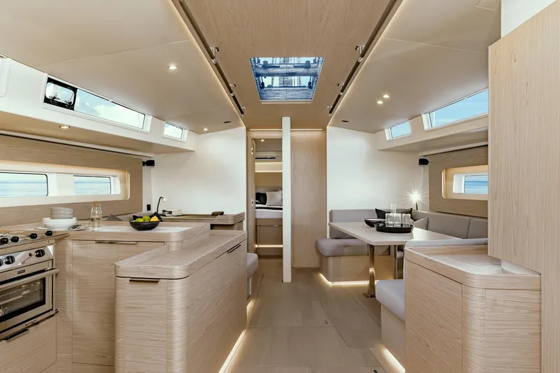 Slide: The Image of Luxurious interior of 2026 Beneteau Oceanis Yacht 54, featuring modern kitchen and dining area. - 12