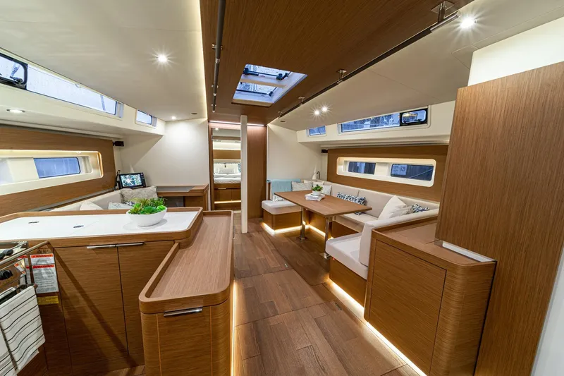 Slide: The Image of Luxurious interior of 2026 Beneteau Oceanis Yacht 54 with modern wood finish and elegant seating. - 13