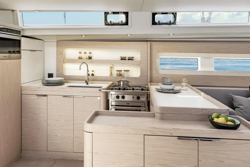 Slide: The Image of Luxurious kitchen interior of 2026 Beneteau Oceanis Yacht 54 with modern amenities and ocean view. - 7