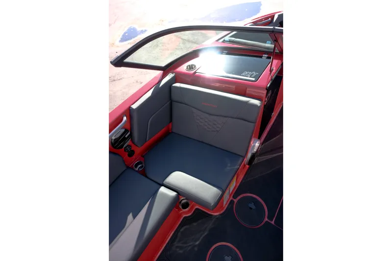 Slide: The Image of 2026 MasterCraft NXT22 boat interior with red and gray seating. - 18