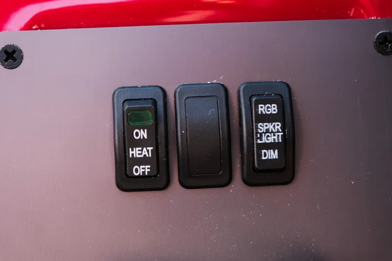 Slide: The Image of Control panel switches on a 2026 MasterCraft NXT22 boat. - 26