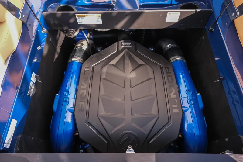 Slide: The Image of 2026 MasterCraft XT22 engine compartment with Ilmor engine, showcasing blue components. - 13
