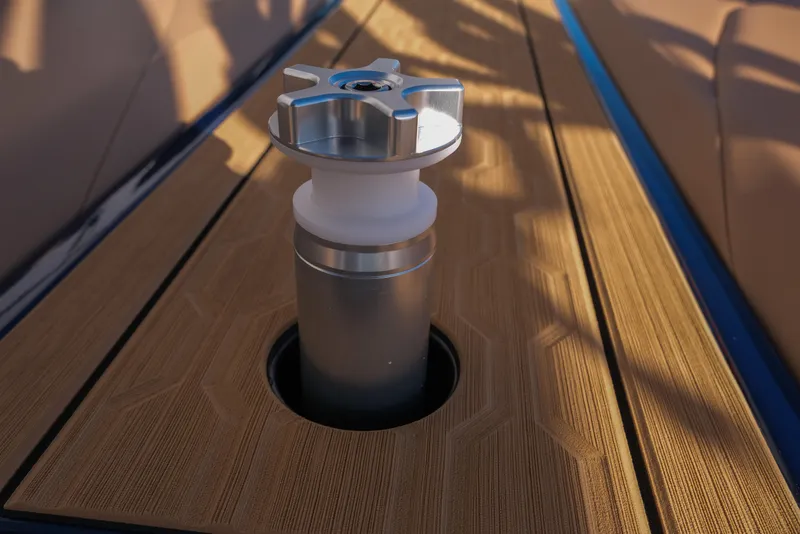 Slide: The Image of 2026 MasterCraft XT22 boat detail with metallic fixture on wooden deck. - 14