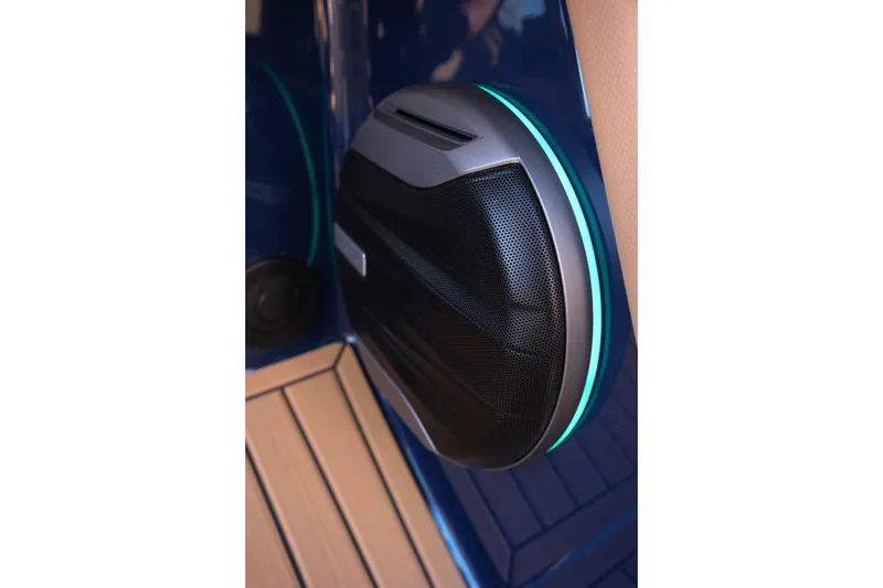 Slide: The Image of 2026 MasterCraft XT22 boat speaker with sleek design and ambient lighting. - 15