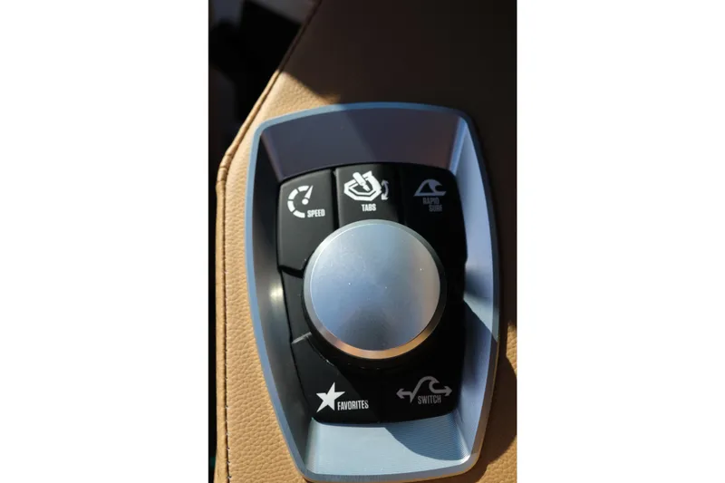 Slide: The Image of 2026 MasterCraft XT22 control panel with speed, tabs, and rapid surf options. - 19