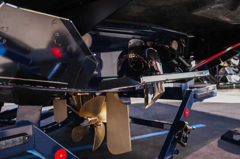 Slide: The Image of 2026 MasterCraft XT22 boat underside with propeller and mechanical components. - 8