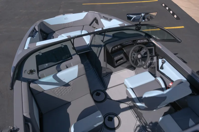 Slide: The Image of Interior view of 2026 MasterCraft NXT20 boat, featuring sleek design and modern controls. - 11