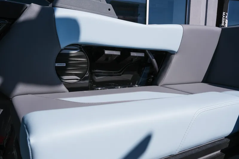 Slide: The Image of 2026 MasterCraft NXT20 boat interior with sleek seating and integrated speaker system. - 13