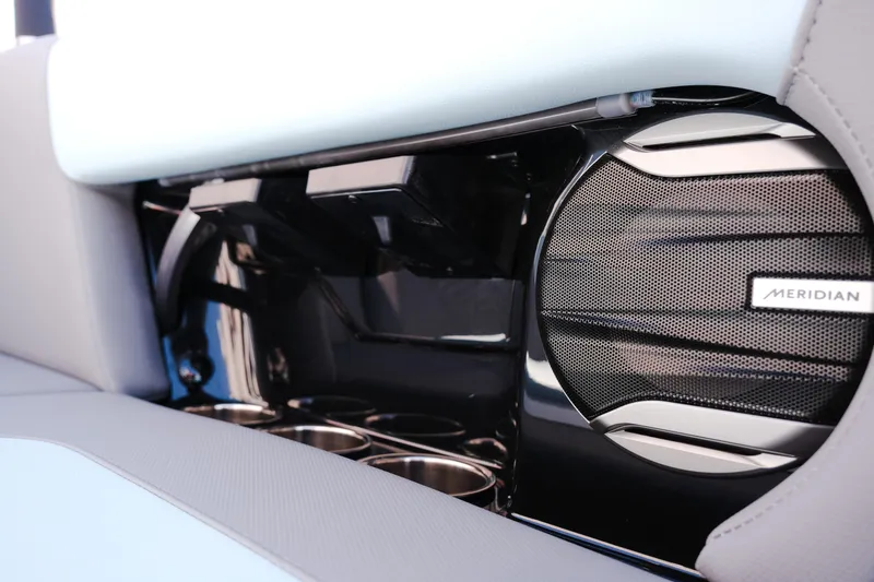 Slide: The Image of 2026 MasterCraft NXT20 interior with Meridian speaker and cup holders. - 14