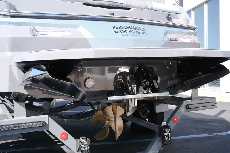 Slide: The Image of 2026 MasterCraft NXT20 boat on trailer, showcasing rear view and propeller details. - 5