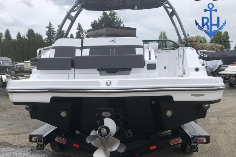 Slide: The Image of 2022 Monterey M4 boat rear view with dual propellers on a trailer. - 7