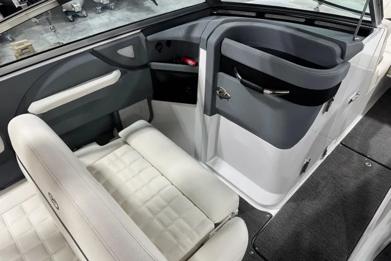 Slide: The Image of Interior of 2018 Cobalt R5 Surf boat with white seating and gray accents. - 10