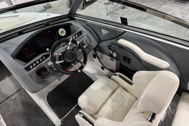 Slide: The Image of 2018 Cobalt R5 Surf boat cockpit with modern steering and control panel. - 11