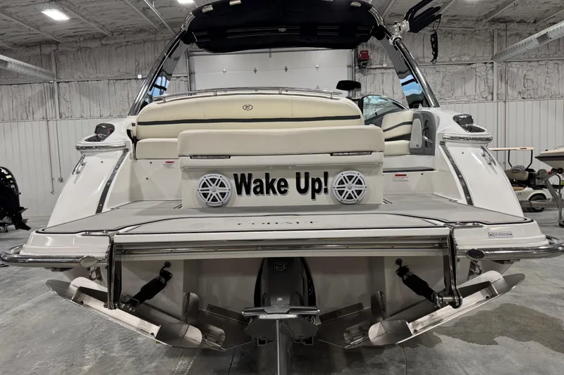 Slide: The Image of 2018 Cobalt R5 Surf boat in a garage, featuring "Wake Up!" text on the back. - 6