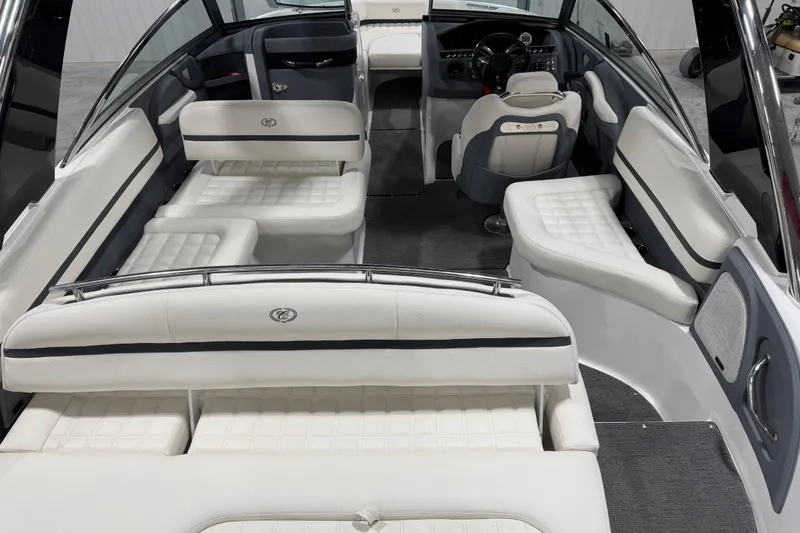 Slide: The Image of 2018 Cobalt R5 Surf boat interior with white seating and modern dashboard. - 7
