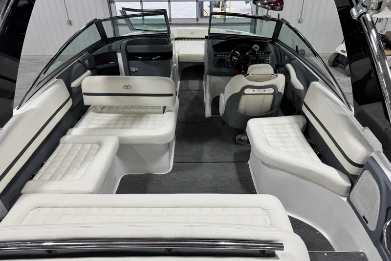 Slide: The Image of 2018 Cobalt R5 Surf boat interior with white seating and modern dashboard design. - 8