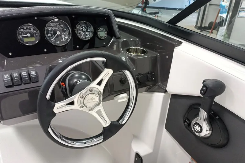 Slide: The Image of 2025 Monterey M-225 boat dashboard with steering wheel and control panel. - 4