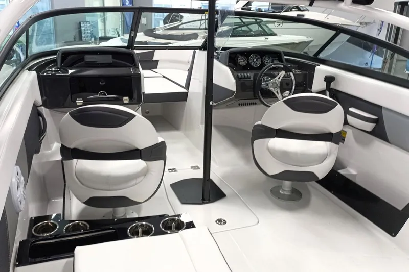 Slide: The Image of 2025 Monterey M-225 boat interior with modern dashboard, dual seats, and sleek design. - 8