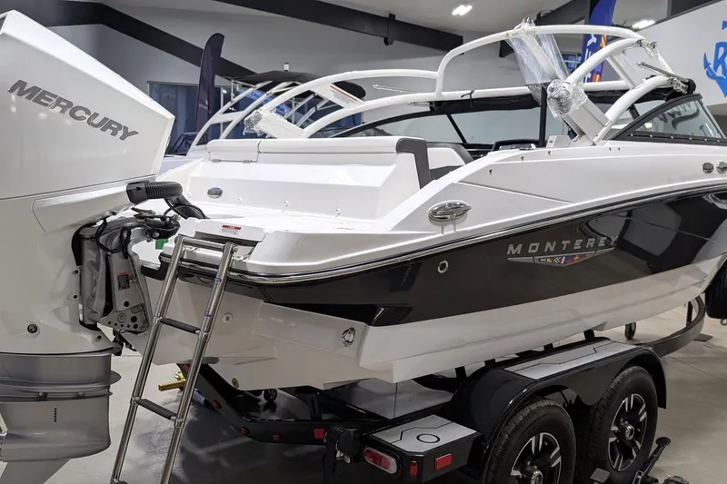 Slide: The Image of 2025 Monterey M-205 boat with Mercury engine on trailer in showroom. - 3