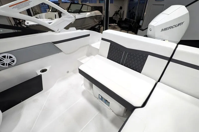 Slide: The Image of 2025 Monterey M-205 boat interior with white seating and Mercury engine. - 5