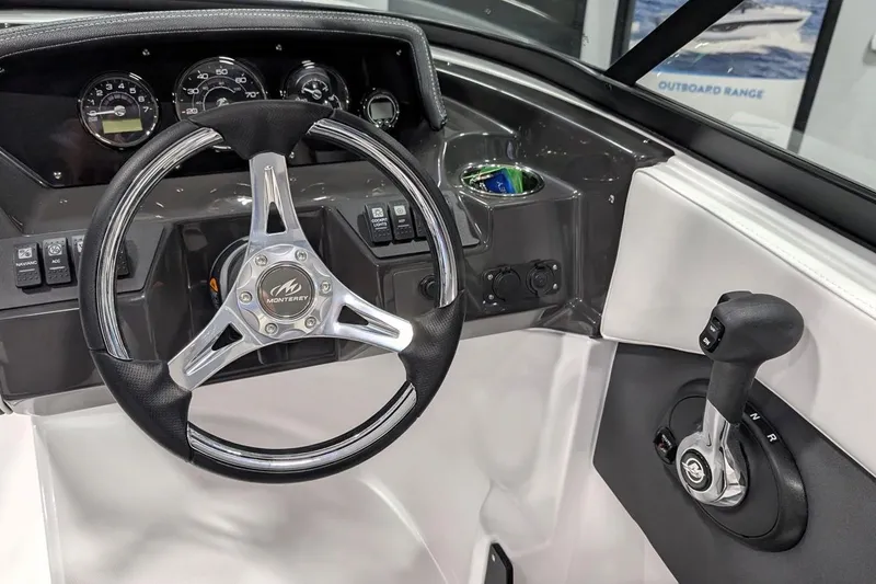 Slide: The Image of Steering wheel and controls of 2025 Monterey M-205 boat cockpit. - 7