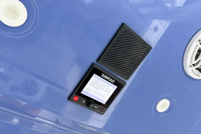 Slide: The Image of Simrad display on 2022 Costa Custom Boats 264, featuring marine electronics and speaker. - 14