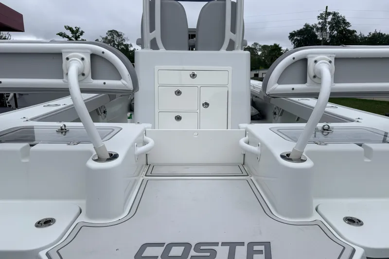 Slide: The Image of 2022 Costa Custom Boats 264 interior with storage compartments and seating. - 17