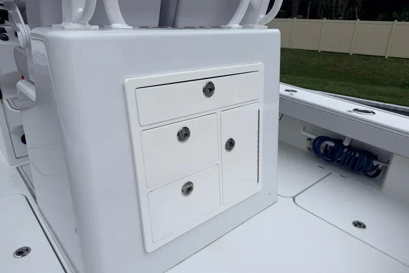 Slide: The Image of 2022 Costa Custom Boats 264 interior storage compartments on deck. - 21