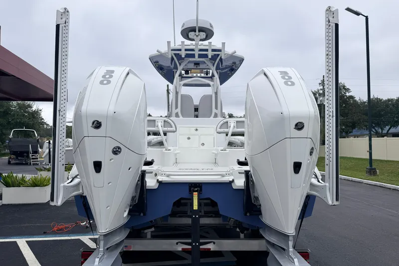 Slide: The Image of 2022 Costa Custom Boats 264 with dual outboard engines, displayed outdoors. - 3