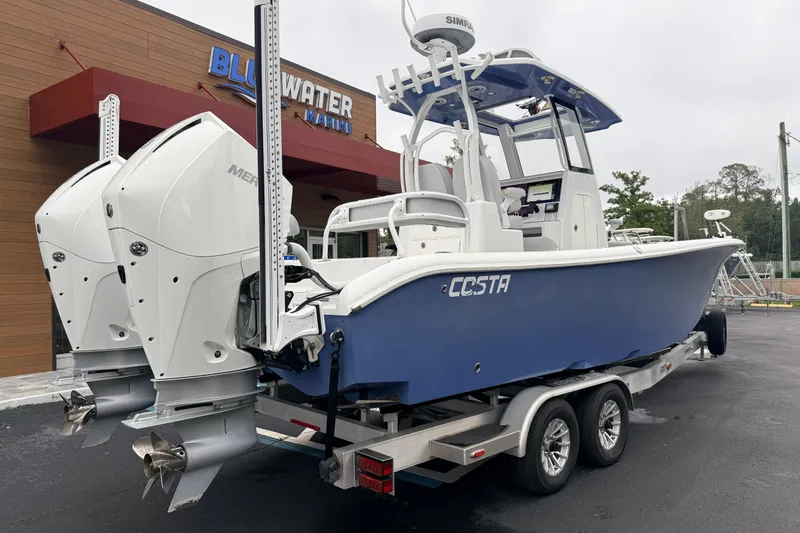 Slide: The Image of 2022 Costa Custom Boats 264 with dual engines on trailer at Bluewater Marine. - 4