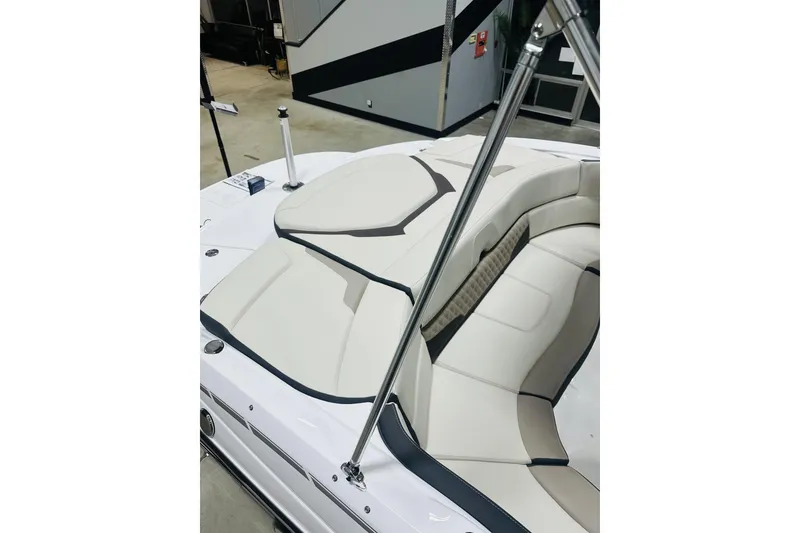 Slide: The Image of 2025 Monterey 224FS boat interior with sleek white seating and modern design. - 12