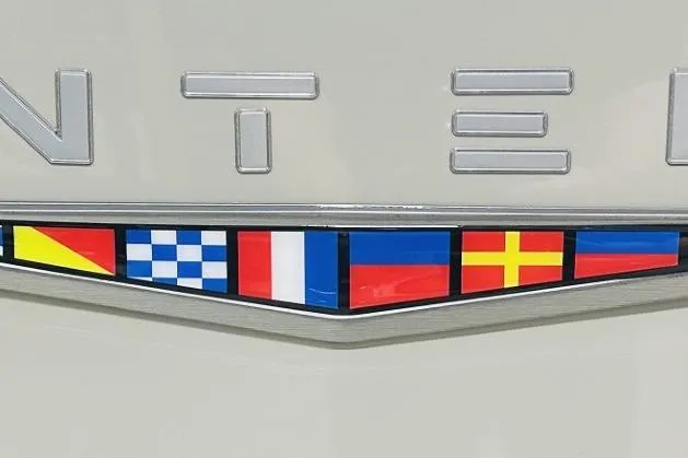 Slide: The Image of 2025 Monterey 224FS emblem with nautical flags on a sleek surface. - 16