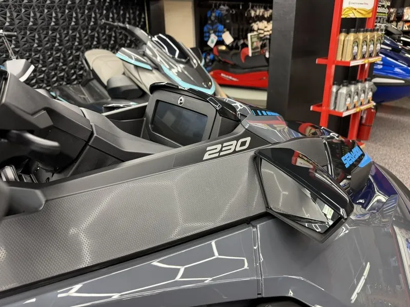 Slide: The Image of 2026 Sea-Doo GTX 230 jet ski displayed in showroom. - 11