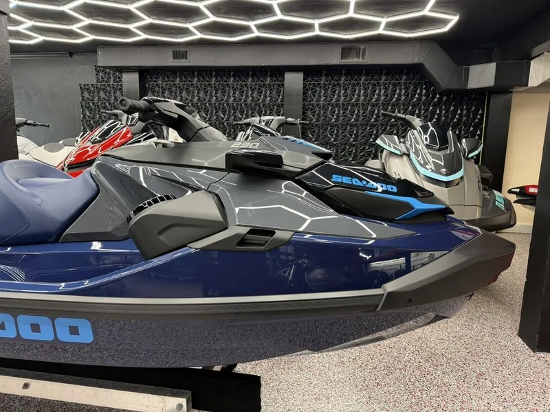 Slide: The Image of 2026 Sea-Doo GTX 230 jet ski in modern showroom. - 2