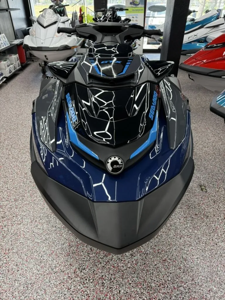 Slide: The Image of 2026 Sea-Doo GTX 230 jet ski displayed in showroom. - 3