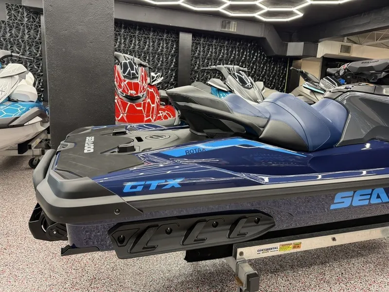 Slide: The Image of 2026 Sea-Doo GTX 230 jet ski in showroom. - 4