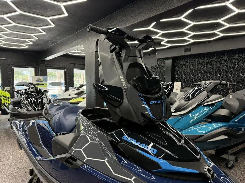 Slide: The Image of 2026 Sea-Doo GTX 230 jet ski in modern showroom. - 6
