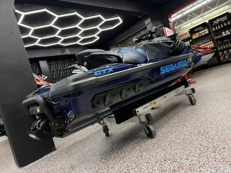 Slide: The Image of 2026 Sea-Doo GTX 230 jet ski in modern showroom. - 8