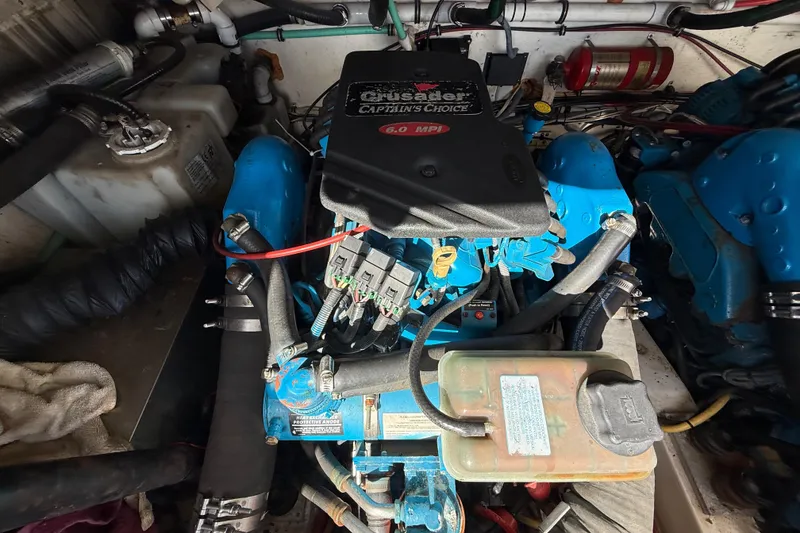 Slide: The Image of Engine compartment of a 2004 Pursuit 3100 Offshore boat with Crusader Captain's Choice engine. - 28