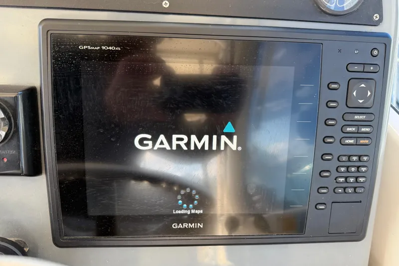 Slide: The Image of Garmin GPSMAP 1040xs display on 2004 Pursuit 3100 Offshore boat dashboard. - 40